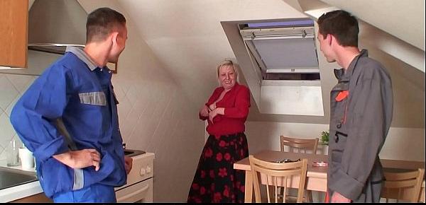  Two repairmen share very old blonde granny